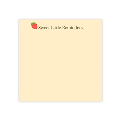 Notepad with 'Sweet Little Reminders' text and strawberry icon on beige background
