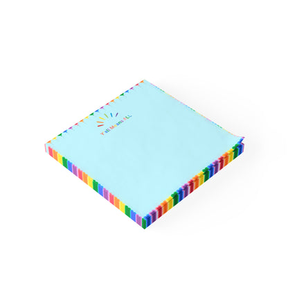 Stack of colorful sticky notes with a rainbow border on a white background