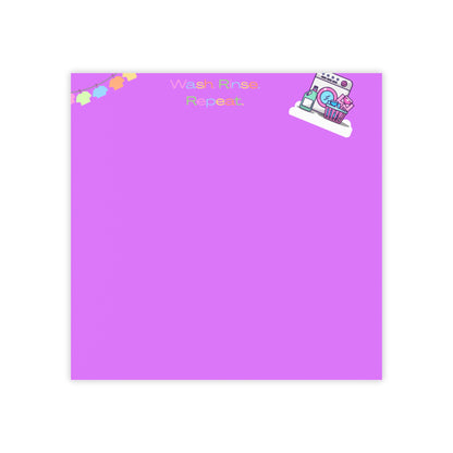 Purple notepad with colorful stickers on a white background