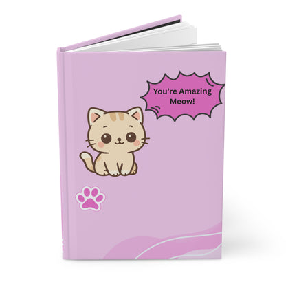 Purple notebook with a cat illustration and 'You're Amazing Meow!' text on a white background