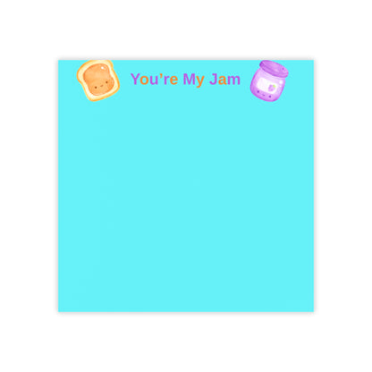 Notepad with 'You're My Jam' text and cartoon illustrations on a blue background