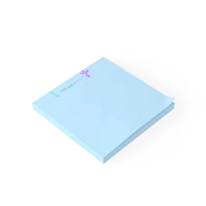 Light blue sticky notes with text on a white background