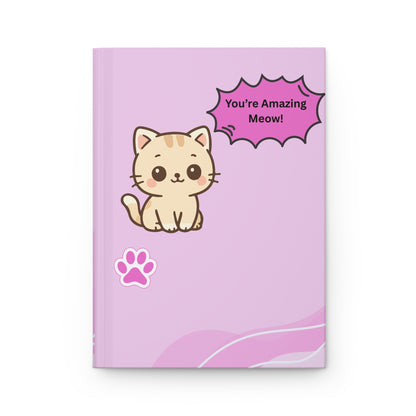 Notebook with a cat illustration and text on a pink background