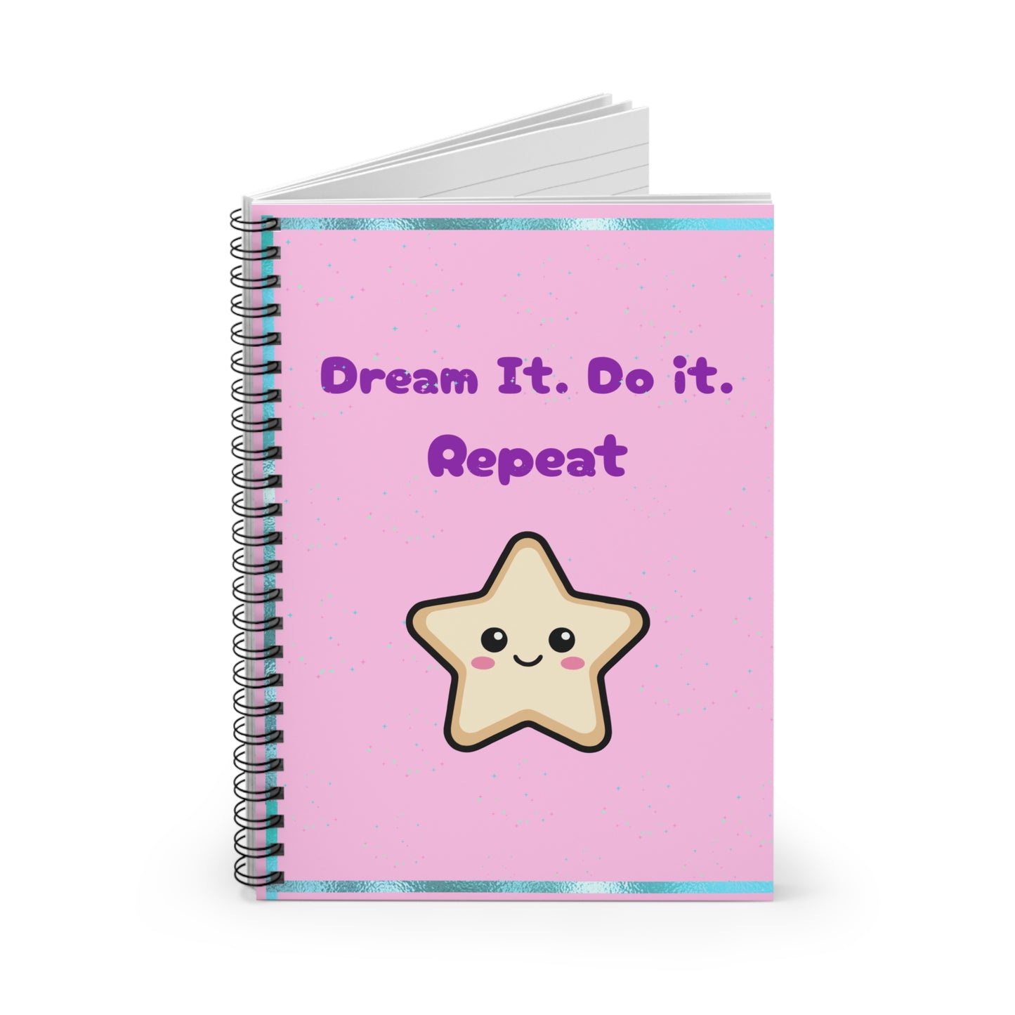 Notebook with a pink cover featuring a star illustration and text 'Dream It. Do it. Repeat' on a white background.