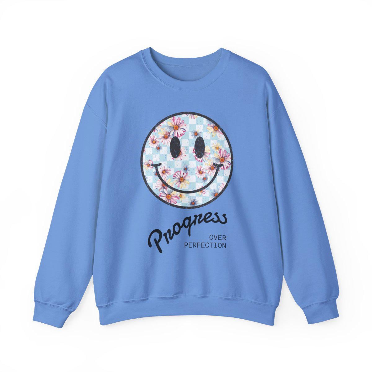 Blue sweatshirt with a smiley face design and text on a white background