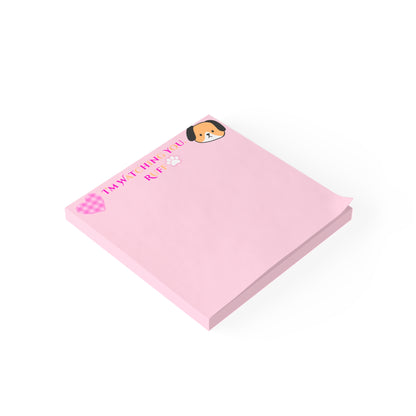 Pink notepad with a dog design on a white background