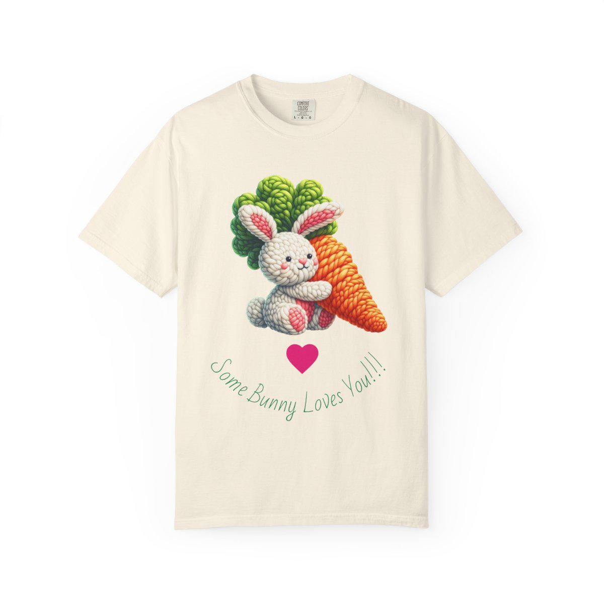 Beige t-shirt with a bunny and carrot design and text on a white background