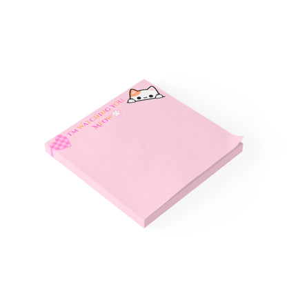 Pink notepad with a cat illustration and text on a white background