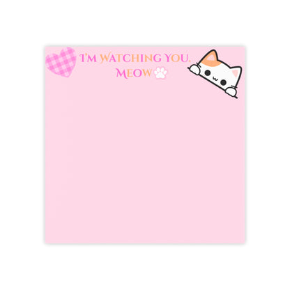 Pink notepad with a cat illustration and text on a white background