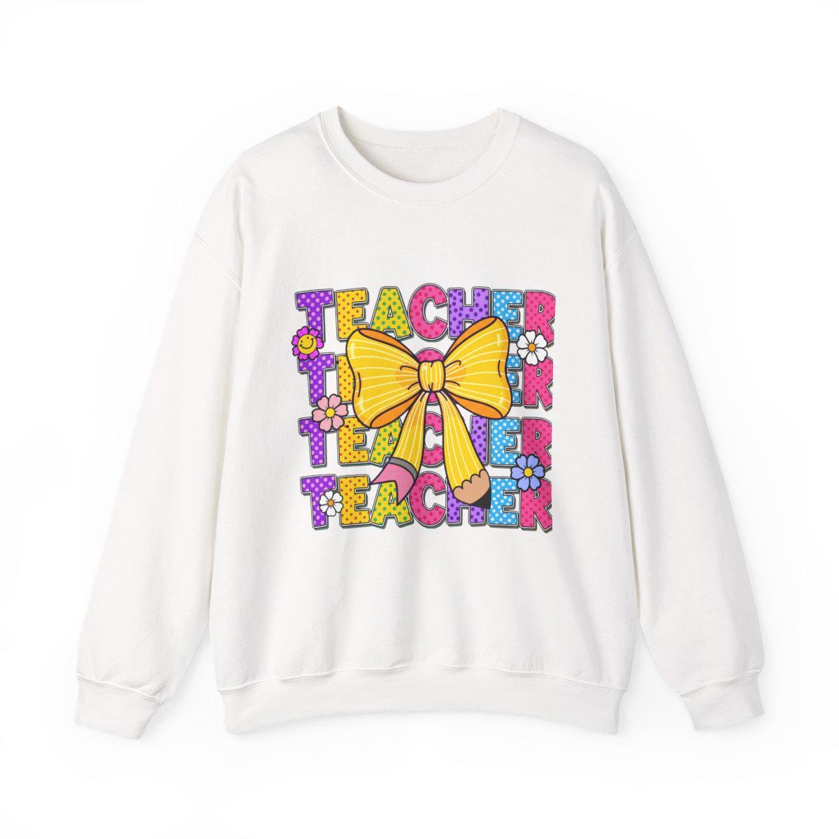 White sweatshirt with colorful 'Teacher' text and bow design on a white background