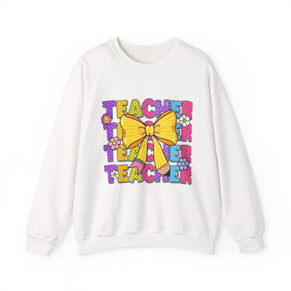 White sweatshirt with colorful 'Teacher' text and bow design on a white background