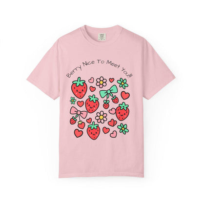 Pink t-shirt with strawberry and heart designs on a white background