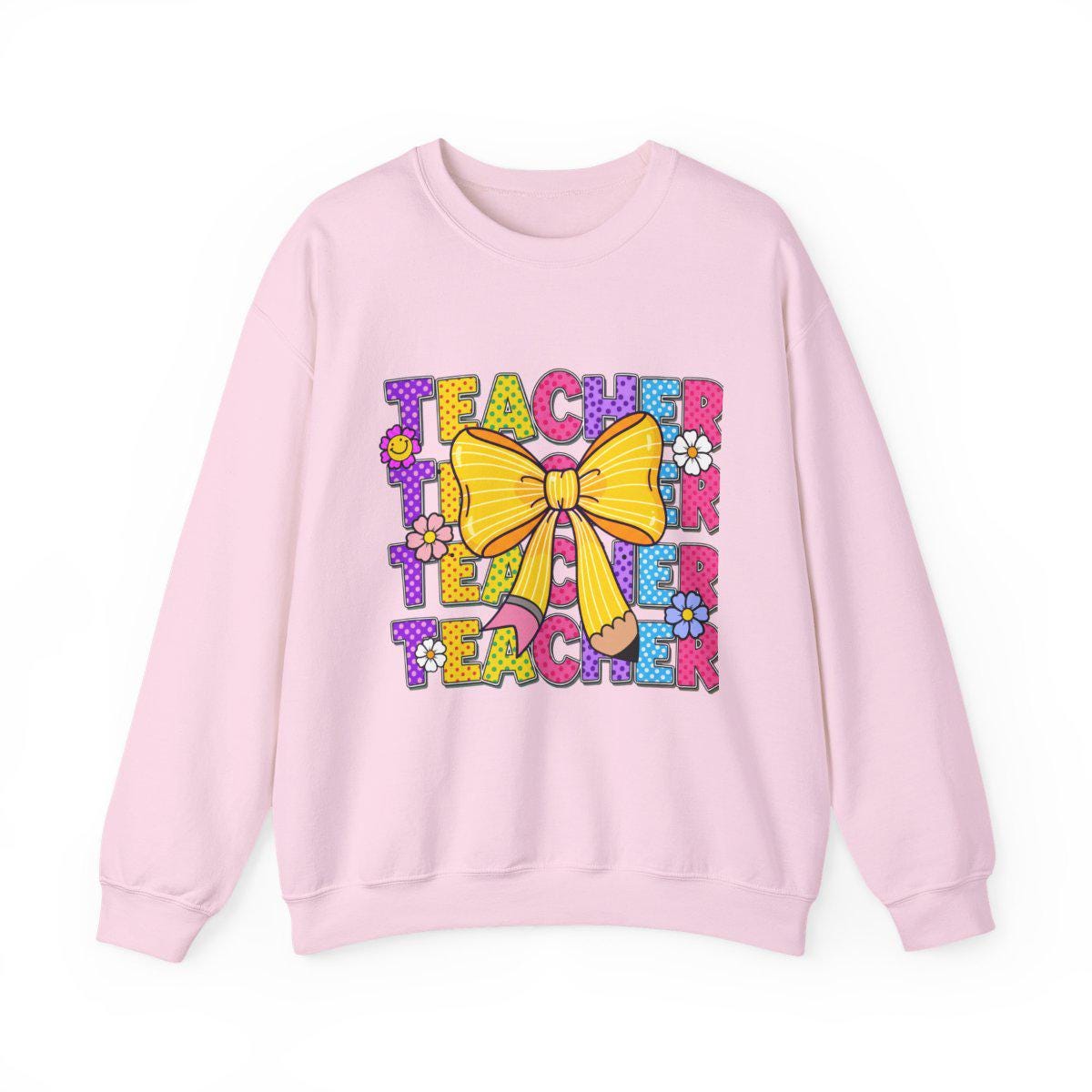 Pink sweatshirt with colorful 'Teacher' text and yellow bow design on a white background
