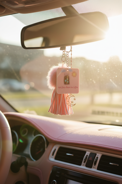 Keychain dangling from car rearview mirror